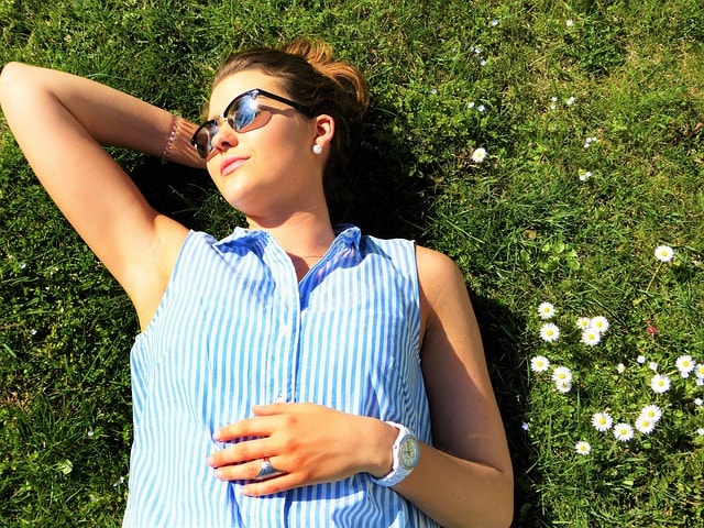 young woman, meadow, lie